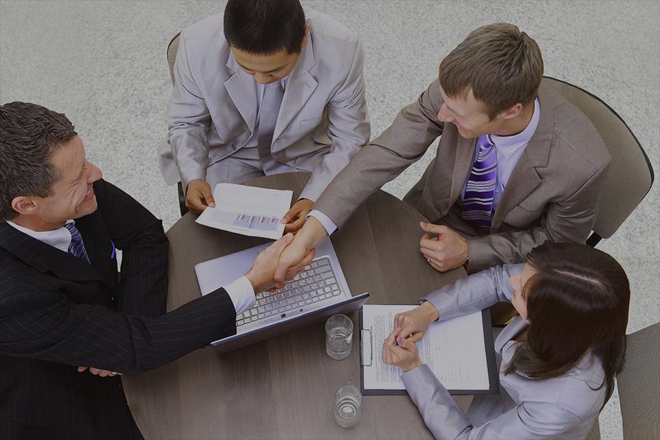 A group of people in a meeting